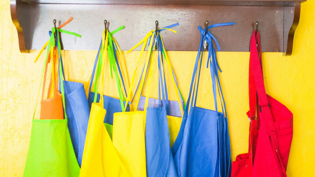 Aprons hanging for food preparation